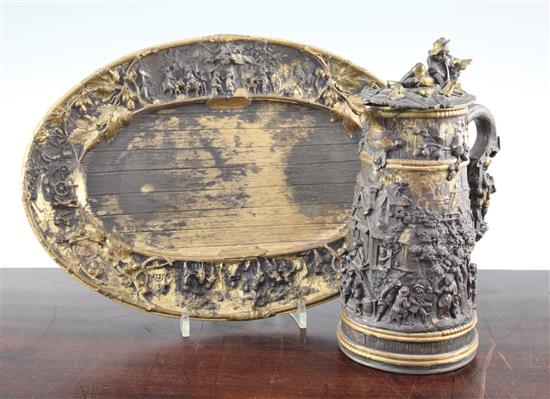 A late 19th century Dutch mixed metal tankard and oval tray, 9in.